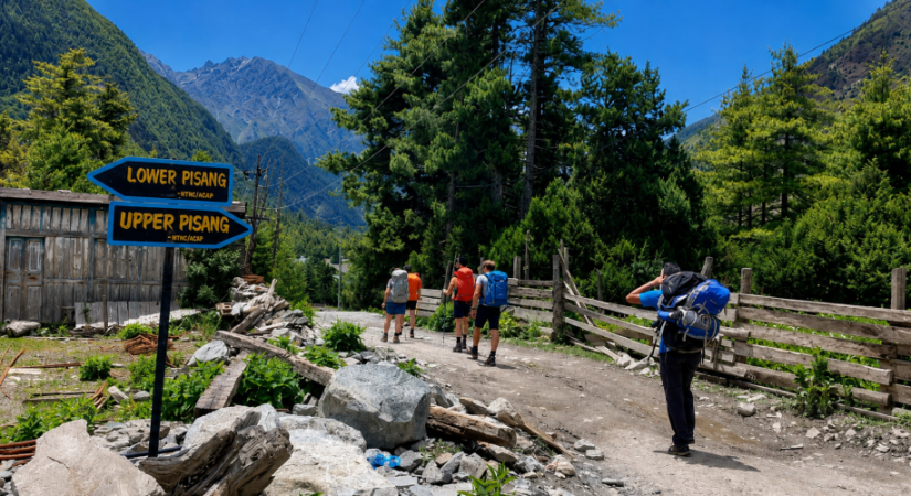 Annapurna Circuit Trek trail to Upper Pisang with trekkers and Himalayan mountain views
